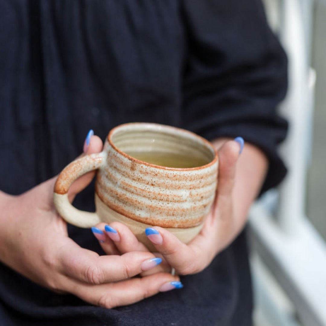 women-hands-holding-ceramic-cup-of herbal-tea.jpeg