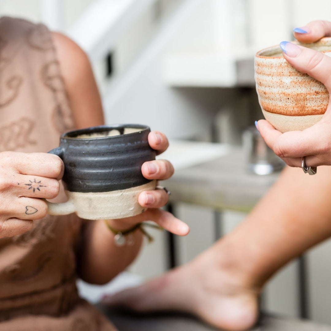 women-holding-cermic-cups-of-tea.jpeg
