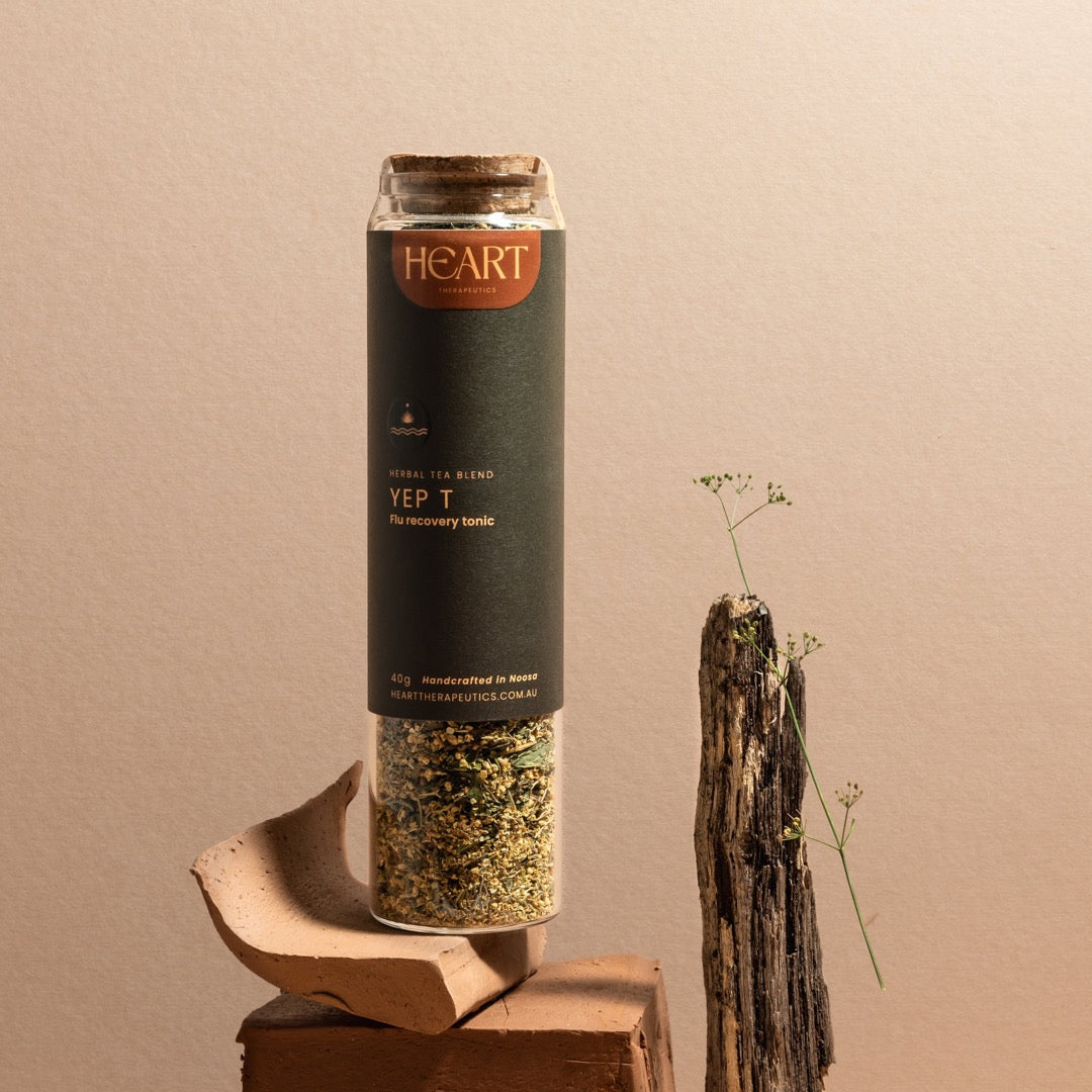 glass jar of organic herbal tea for colds and flus